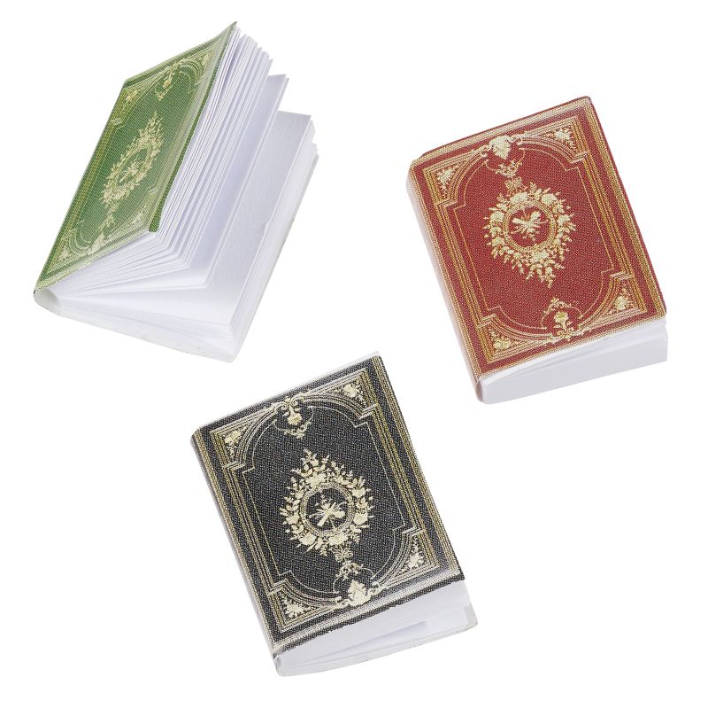 Drei Miniatur Bücher in den Farben Grün, Rot und Schwarz mit goldenen Ornamenten, Wichtel Zubehör und Dekoration für Geldgeschenke.